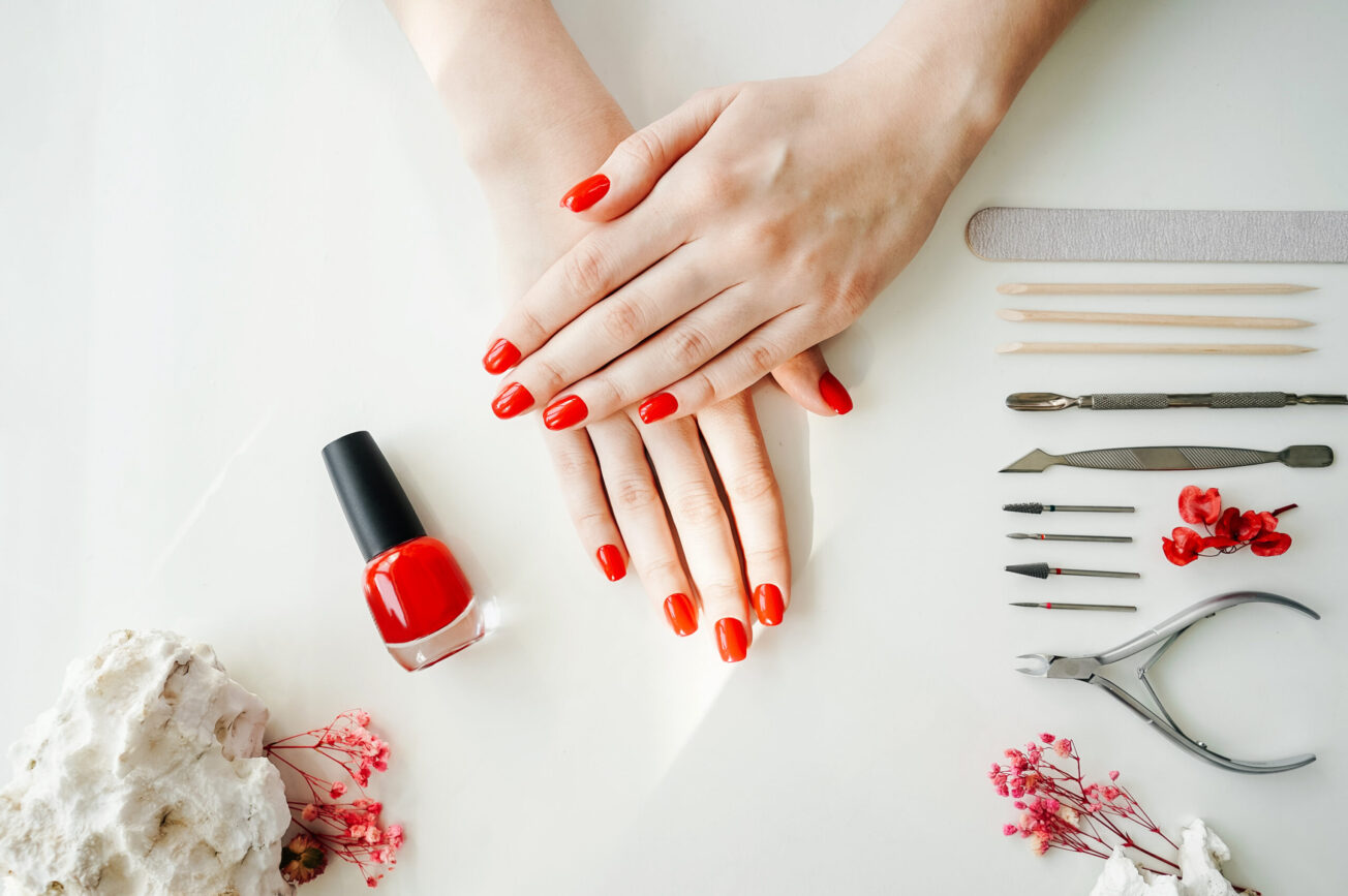 manicured woman s nails with red nail polish 2021 09 02 11 54 23 utc scaled e1696141529591